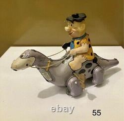 #55 Vintage 1960s Marx Fred Flintstone on Dino Wind-Up Toy Tin Toy
