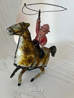 Louis Marx Vintage RIde Em Cowboy Litho and Celluloid Windup Tin Toy