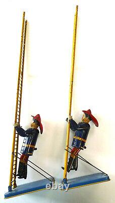 Pair Marx firefighter tin wind up toys antique vintage 1930 children firemen