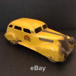 VINTAGE LOUIS MARX YELLOW TAXI -TIN with WOOD WHEELS & SPARE TIRE 1930s WINDUP CAR