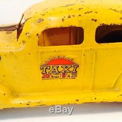 VINTAGE LOUIS MARX YELLOW TAXI -TIN with WOOD WHEELS & SPARE TIRE 1930s WINDUP CAR