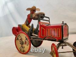 Vintage 1920s MARX tin windup Whoopie Cowboy Car, works well great color. Wow