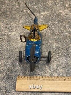 Vintage 1930's Marx roll-over 5 plane #12. Tin wind-up stunt airplane