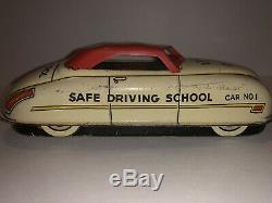 Vintage Tin Lithograph Driving School Wind-Up Car made by the Marx Toy Company