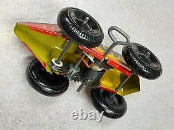 Vintage black, yellow, & red #3 tin wind-up race car by Marx circa 1945 used