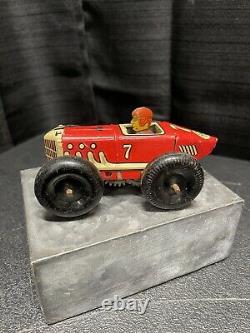 Vintage red & yellow #7 tin wind-up race car by Marx Toys circa 1945