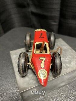 Vintage red & yellow #7 tin wind-up race car by Marx Toys circa 1945