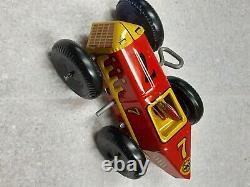 Vintage red & yellow #7 tin wind-up race car by Marx Toys circa 1945 barely used