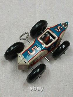 Vintage white & blue #5 tin wind-up race car by Marx Toys circa 1945 barely used