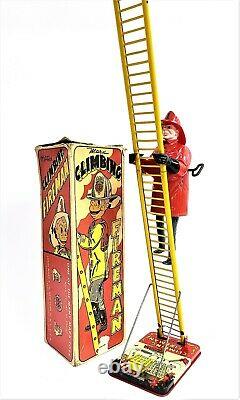 WORKING Louis Marx & Co. Smokey Joe climbing firefighter Vintage wind up tin toy