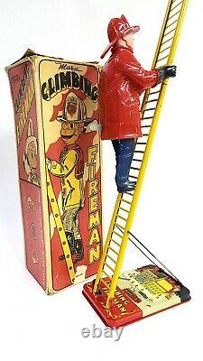 WORKING Louis Marx & Co. Smokey Joe climbing firefighter Vintage wind up tin toy